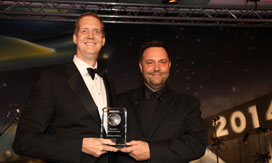 Photo of Jim Butler accepting award.